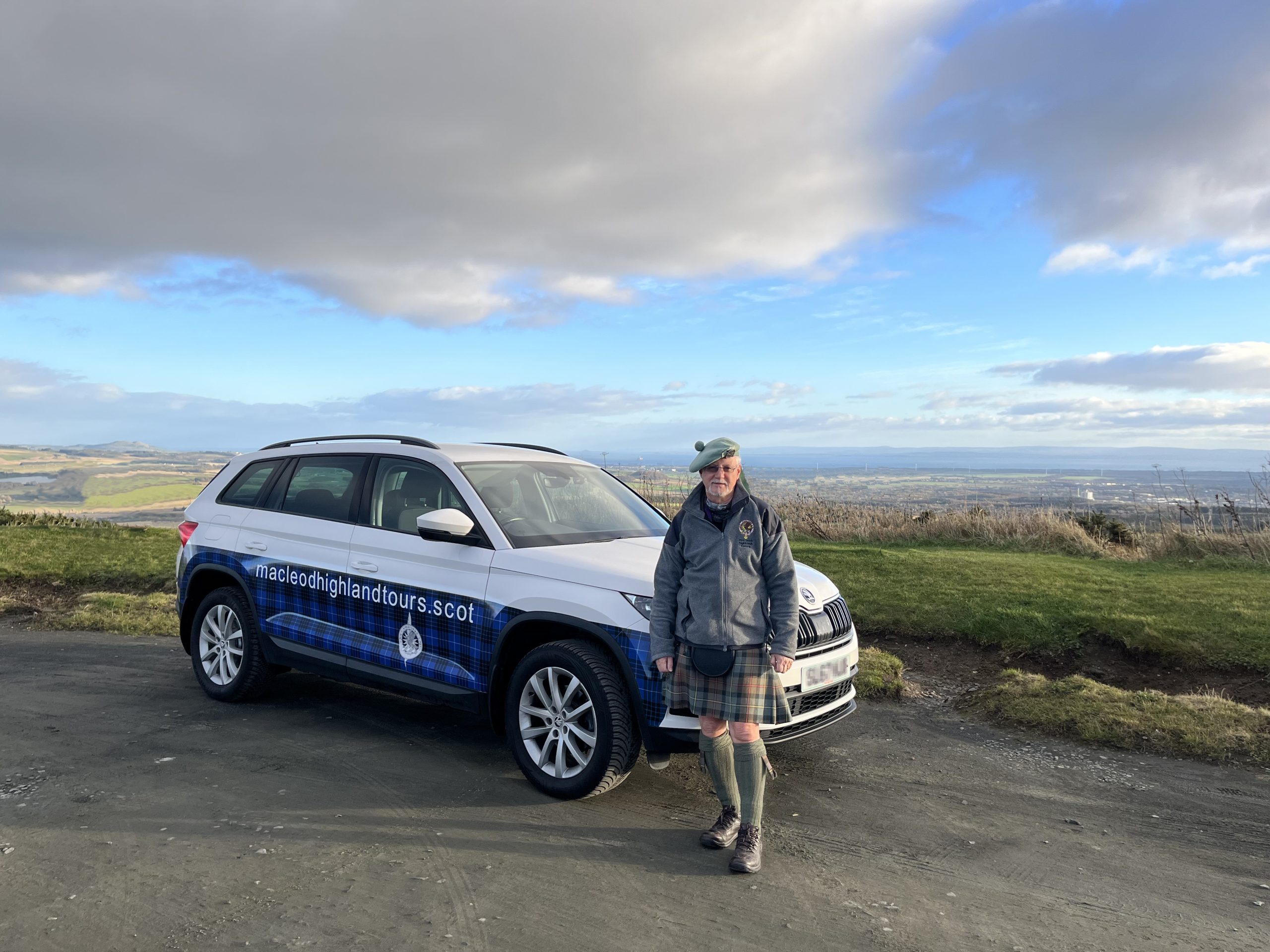 Caoimhìn Iain Tolmach with tour vehicle 'Saoirse'. Caoimhìn Iain Tolmach with tour vehicle 'Saoirse'.